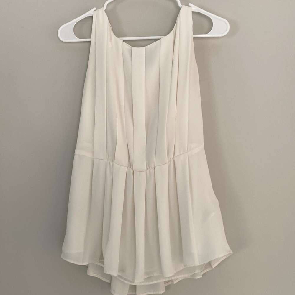 Cream sleeveless blouse from Banana Republic.